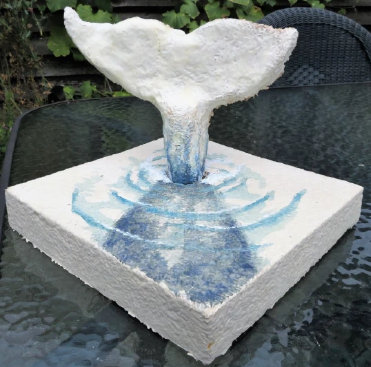 A whale sticking out of a white block